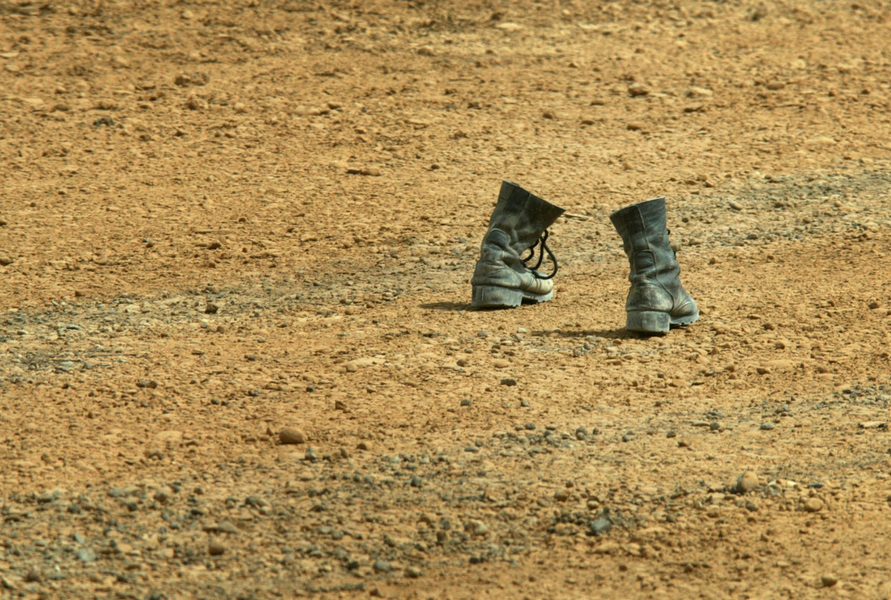 A pair of boots is among the debris left behind as deserting Iraqi soldiers don civilian garb to blend into the civilian population as US Marines advanced towards Baghdad. © 2003 Mark Avery/Orange County Register